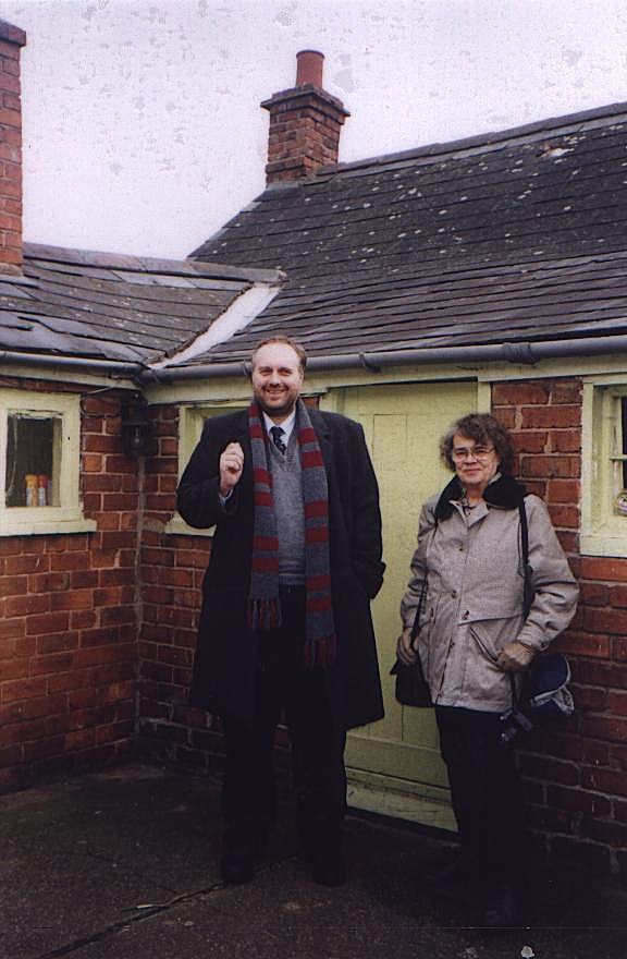 Stephen Roberts and Dorothy Thompson standing at the rear of the cottage